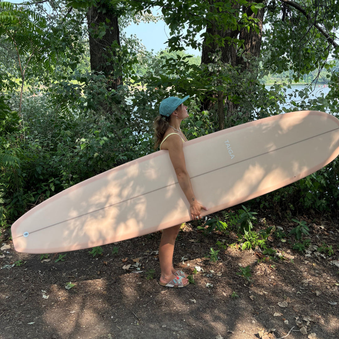 Side View of the girl wearing the Dad Hat Surf & Paddle in Dark Mint Color