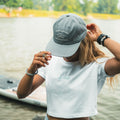 Girl wearing the Dad Hat Surf & Paddle in Grey