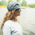 Side View of a girl wearing the Dad Hat Surf & Paddle in Grey