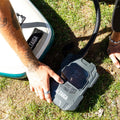 Person using a digital air pump up to 22 PSI for inflating paddle board