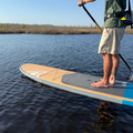 Side View of a Paddler On The Borea 10'6" in Color Sea Blue 