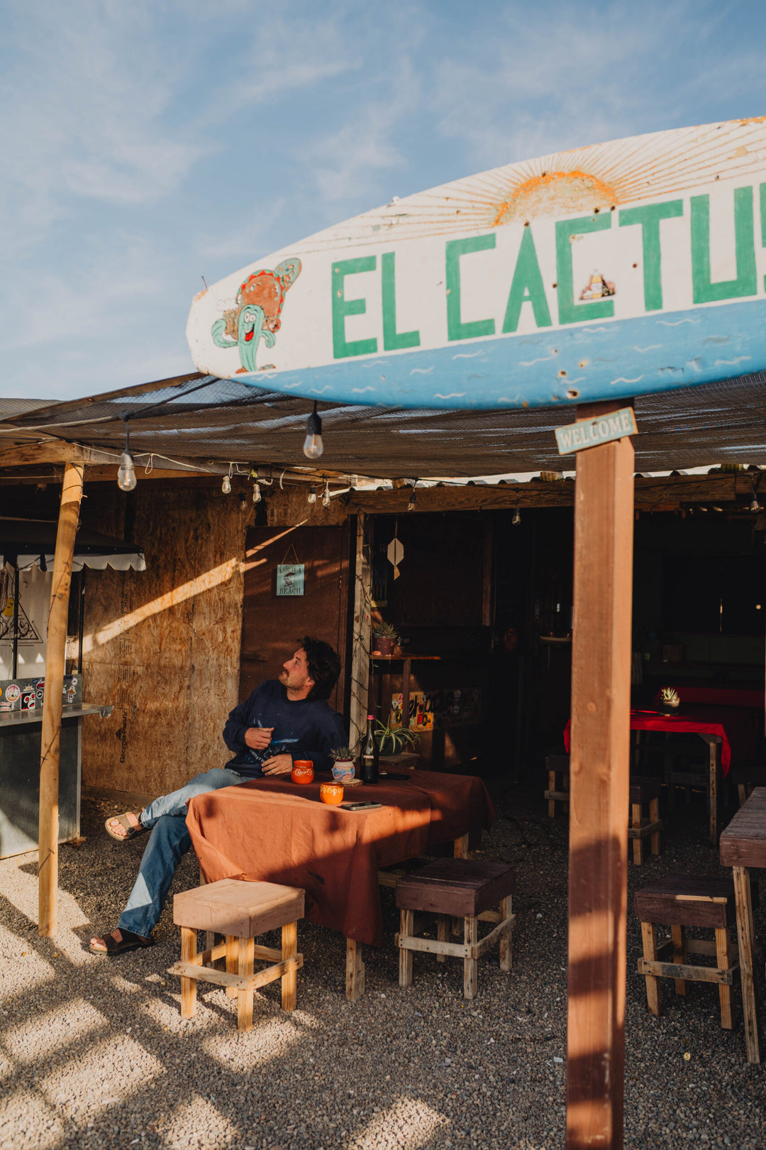 Guy sitting at a table at El Cactus Café 