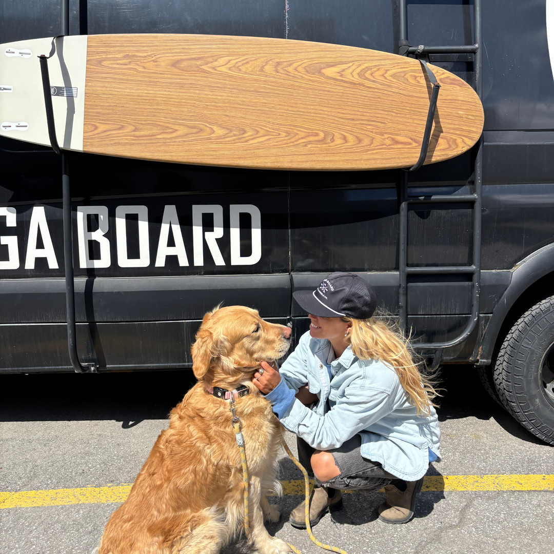 Girl Wearing the Mesh Surf & Paddle Co. Cap with her dog  