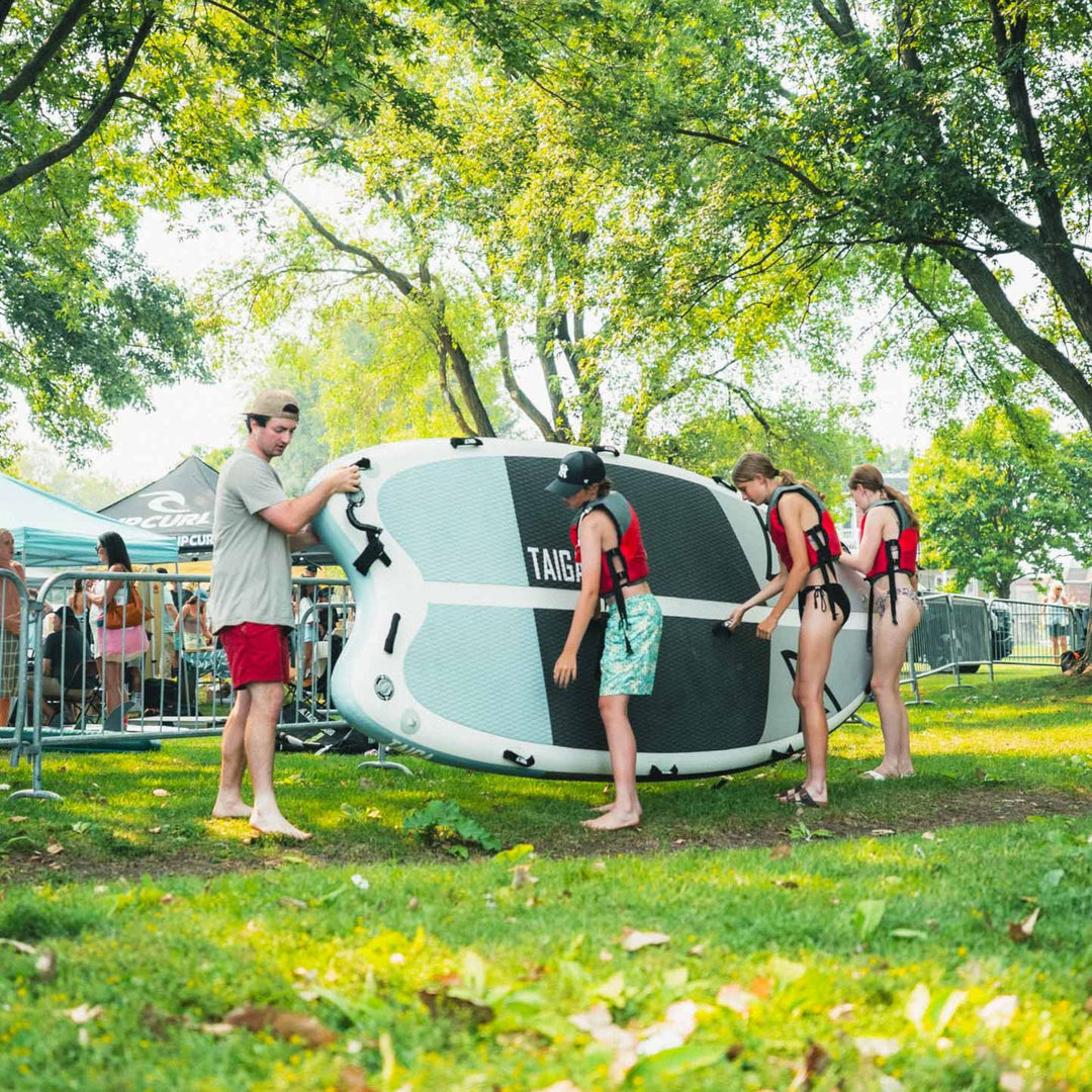 Paddlers holding the Sequoia Air 13'6" Light Construction