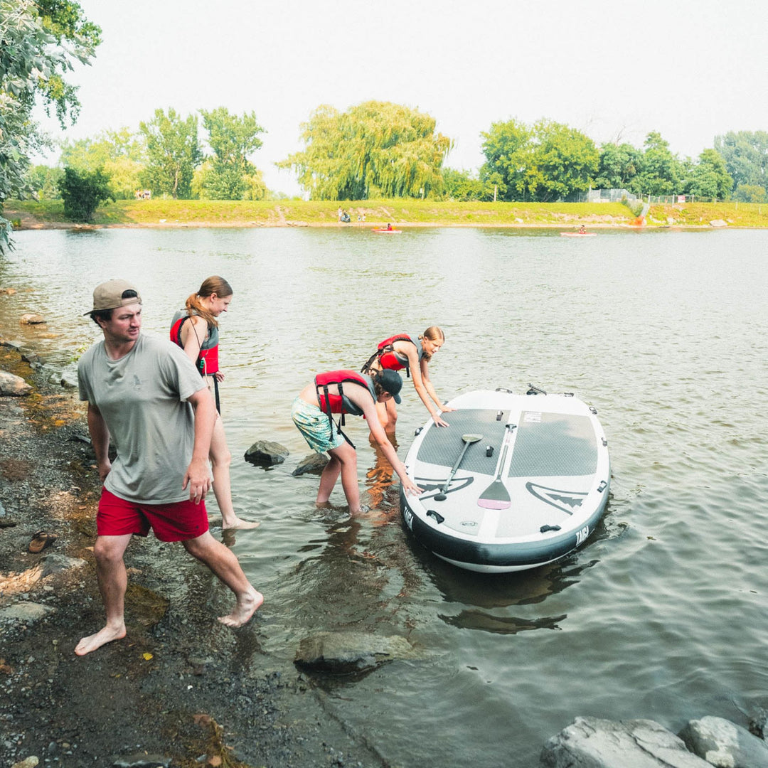 Paddlers on a lake with the Sequoia Air 13'6" LIGHT CONSTRUCTION