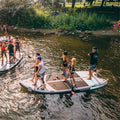 2 groups of people paddling on the Sequoia Air 16'5" Party SUP