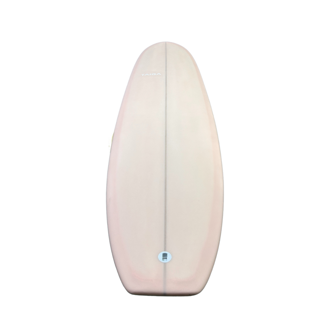 Tail View of The Longboard Surf Board in The Rosé Color