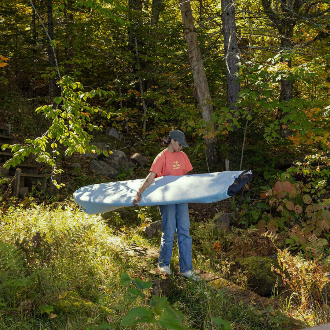 Person holding a surf sock for a longboard