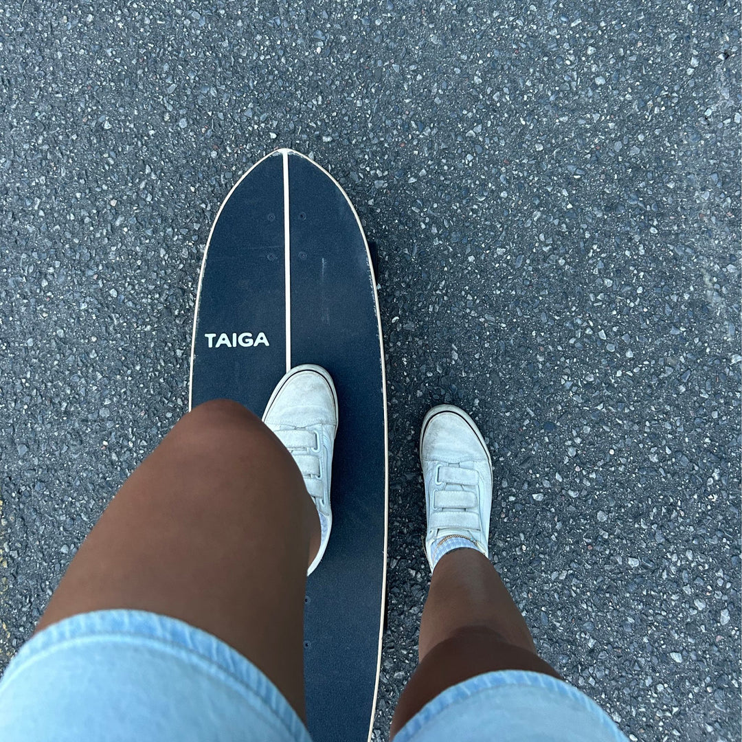 Skater Standing On Top of The Surfskate