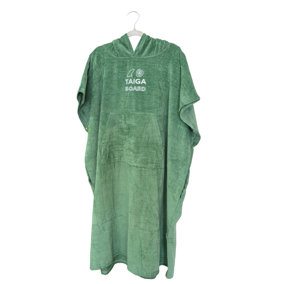 Green poncho with a brand logo on a white background