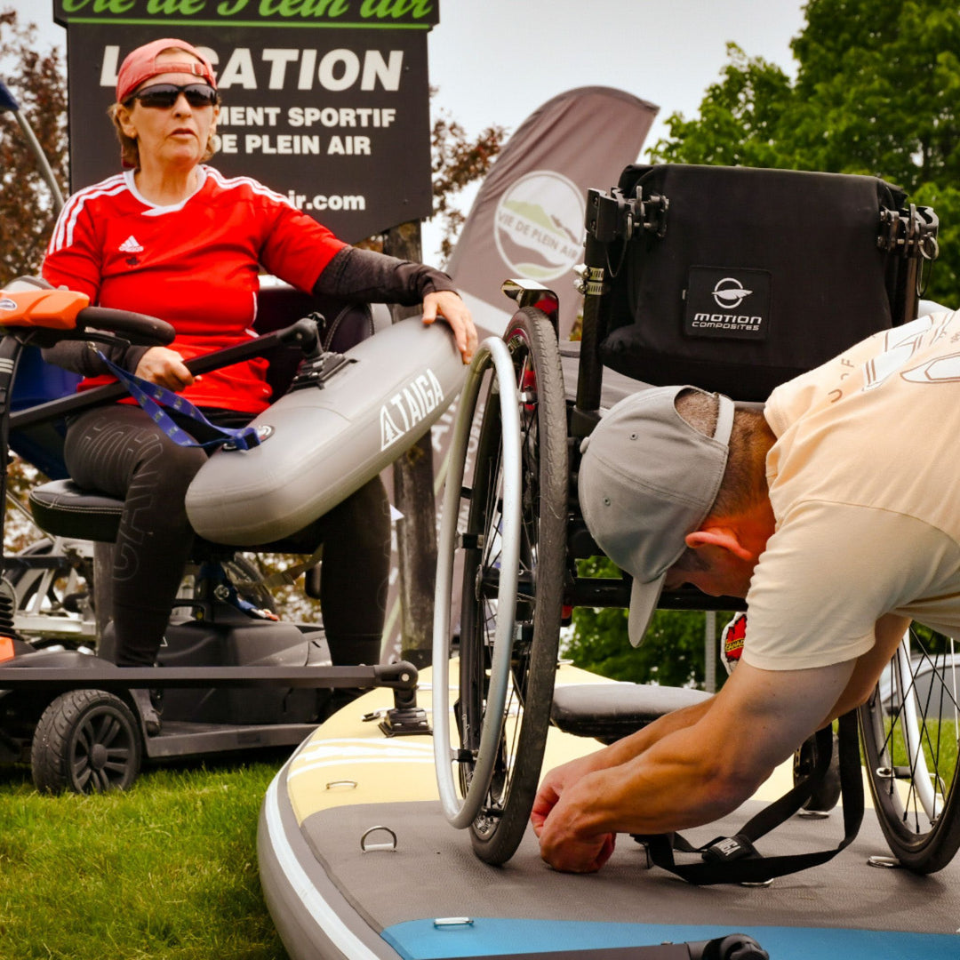 Person in a wheelchair preparing a Adaptive Paddle Board