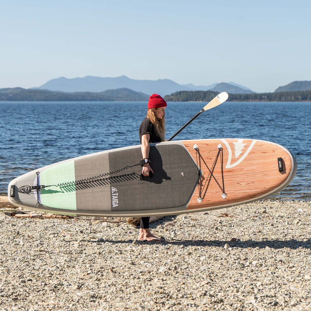 Girl holding the Borea Air 10'6 seafoam